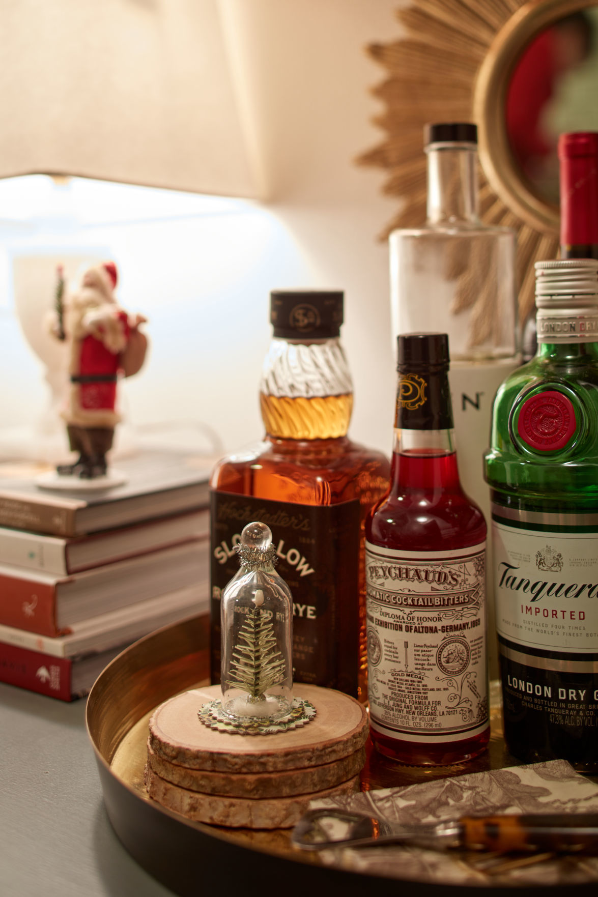 A little tree ornament sits next to drinks.